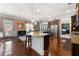 Well-designed kitchen with granite counters, stainless appliances, and a breakfast bar with seamless flow to dining space at 2745 Veltre Sw Ter, Atlanta, GA 30311
