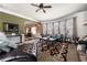 Elegant living room with large windows, decorative rug, and comfortable leather furniture at 2745 Veltre Sw Ter, Atlanta, GA 30311