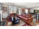 Comfortable living space with a fireplace, hardwood floors, and view of kitchen and dining area at 2745 Veltre Sw Ter, Atlanta, GA 30311