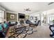 Bright living room with a fireplace, elegant decor, and seamless flow to other areas, offering a perfect blend of comfort and style at 2745 Veltre Sw Ter, Atlanta, GA 30311