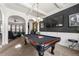 Entertainment room with a pool table and access to a living area, ideal for hosting guests and enjoying leisure activities at 2745 Veltre Sw Ter, Atlanta, GA 30311