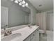 This bathroom features double sinks, a large mirror and shower with bathtub at 2920 Olde Towne Pkwy, Duluth, GA 30097