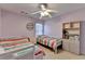 This bedroom features two twin beds, natural light, and unique bookshelf at 2920 Olde Towne Pkwy, Duluth, GA 30097
