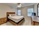 Bedroom with wooden furniture, two windows and white walls at 2920 Olde Towne Pkwy, Duluth, GA 30097