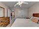 This bright bedroom features a ceiling fan, natural light, and a spacious closet at 2920 Olde Towne Pkwy, Duluth, GA 30097
