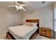Bedroom with white bedding, and wood furnishings at 2920 Olde Towne Pkwy, Duluth, GA 30097