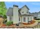 Rear exterior view of home and backyard with manicured landscaping at 2920 Olde Towne Pkwy, Duluth, GA 30097