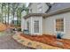 Back of house with bay window, patio, and gravel landscaping at 2920 Olde Towne Pkwy, Duluth, GA 30097