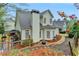 Exterior view of the home showcasing the deck, yard, and landscaping at 2920 Olde Towne Pkwy, Duluth, GA 30097