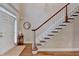 Inviting foyer featuring hardwood floors, a staircase, and a front door with sidelights at 2920 Olde Towne Pkwy, Duluth, GA 30097