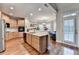 Spacious kitchen with wooden cabinets, stainless steel appliances, and hardwood flooring at 2920 Olde Towne Pkwy, Duluth, GA 30097