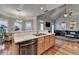 Bright open kitchen with hardwood floors, stainless steel appliances, and breakfast bar at 2920 Olde Towne Pkwy, Duluth, GA 30097
