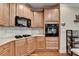 Close up of kitchen with wooden cabinets and stainless steel appliances at 2920 Olde Towne Pkwy, Duluth, GA 30097