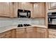 Close up of kitchen with wooden cabinets and stainless steel appliances at 2920 Olde Towne Pkwy, Duluth, GA 30097