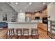 Open kitchen with breakfast bar, wooden cabinets, and stainless steel appliances at 2920 Olde Towne Pkwy, Duluth, GA 30097