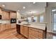 Spacious kitchen with wooden cabinets, stainless steel appliances, and hardwood flooring at 2920 Olde Towne Pkwy, Duluth, GA 30097