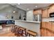 Open kitchen with breakfast bar, wooden cabinets, and stainless steel appliances at 2920 Olde Towne Pkwy, Duluth, GA 30097