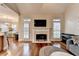 Open-concept living room featuring fireplace and hardwood floors at 2920 Olde Towne Pkwy, Duluth, GA 30097