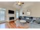 Bright living room with fireplace and hardwood floors at 2920 Olde Towne Pkwy, Duluth, GA 30097