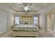 Spacious main bedroom with a tray ceiling, fan, and neutral color palette at 2920 Olde Towne Pkwy, Duluth, GA 30097