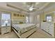 This main bedroom has a tray ceiling and a full dresser at 2920 Olde Towne Pkwy, Duluth, GA 30097