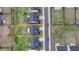 Aerial view of the two-story home with a driveway and neatly landscaped front and back lawn at 4650 Sandy Creek Dr, Cumming, GA 30028
