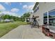 Spacious backyard featuring lush green grass, a patio with a swing, and a view of the surrounding landscape at 4650 Sandy Creek Dr, Cumming, GA 30028