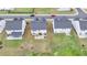 Aerial view of the home's backyard with a patio and lawn at 4650 Sandy Creek Dr, Cumming, GA 30028