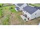 Aerial view of the backyard with green grass and a trampoline at 4650 Sandy Creek Dr, Cumming, GA 30028
