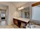 The bathroom is well lit with a large vanity area with a separate shower and tub at 4650 Sandy Creek Dr, Cumming, GA 30028