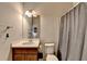 Cozy bathroom with vanity, mirror, and shower with curtain at 4650 Sandy Creek Dr, Cumming, GA 30028