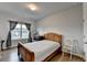 Cozy bedroom with hardwood floors, a window, and natural light at 4650 Sandy Creek Dr, Cumming, GA 30028