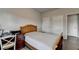 Comfortable bedroom with hardwood floors and neutral-colored walls at 4650 Sandy Creek Dr, Cumming, GA 30028