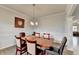 Bright dining room featuring hardwood floors, natural light, and elegant trim details at 4650 Sandy Creek Dr, Cumming, GA 30028