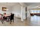 Formal dining room featuring a wood dining table set with modern decorative chandelier and wood laminate flooring at 4650 Sandy Creek Dr, Cumming, GA 30028