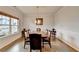 Spacious dining room with hardwood floors, large table, and sophisticated chandelier at 4650 Sandy Creek Dr, Cumming, GA 30028