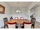 Bright dining room featuring hardwood floors, natural light, and elegant trim details at 4650 Sandy Creek Dr, Cumming, GA 30028
