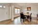 Bright dining room featuring hardwood floors, natural light, and elegant trim details at 4650 Sandy Creek Dr, Cumming, GA 30028