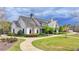 Charming two-story home featuring a landscaped yard and a welcoming entrance at 4650 Sandy Creek Dr, Cumming, GA 30028