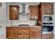 Modern kitchen features stainless appliances, subway tile backsplash, and built in double ovens at 4650 Sandy Creek Dr, Cumming, GA 30028