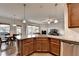 Beautiful kitchen features a granite island, stainless steel appliances and opens to the living room at 4650 Sandy Creek Dr, Cumming, GA 30028