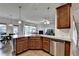 Open kitchen with granite countertops, stainless steel appliances, and eat-in area at 4650 Sandy Creek Dr, Cumming, GA 30028