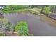 Wide aerial shot of the community lake and surrounding mature trees at 4650 Sandy Creek Dr, Cumming, GA 30028
