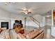 Spacious living area features hardwood floors, cozy fireplace, large windows and a staircase to upper level at 4650 Sandy Creek Dr, Cumming, GA 30028
