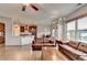 Bright living area seamlessly connects to the kitchen, complemented by hardwood floors and natural light at 4650 Sandy Creek Dr, Cumming, GA 30028