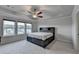 Spacious bedroom with ceiling fan and multiple windows offering ample light at 4650 Sandy Creek Dr, Cumming, GA 30028