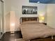 Modern bedroom features wood bed frame, stylish lighting and decor at 860 Peachtree Ne St # 2616, Atlanta, GA 30308