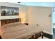 Bedroom with a wooden bed frame, neutral bedding, and modern city skyline art at 860 Peachtree Ne St # 2616, Atlanta, GA 30308