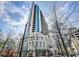 Exterior shot of condo building showing architectural detail; street-level restaurants at 860 Peachtree Ne St # 2616, Atlanta, GA 30308