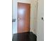 Entry door and hallway with dark wood floors, storage closet, and smart thermostat at 860 Peachtree Ne St # 2616, Atlanta, GA 30308